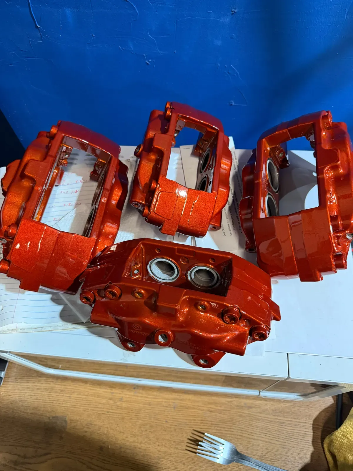 Set of four brake calipers powder coated in red orange